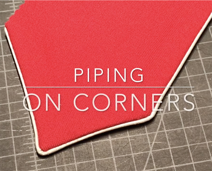 red fabric with white piping